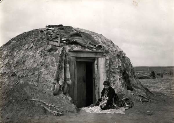 Navajo woman carding wool